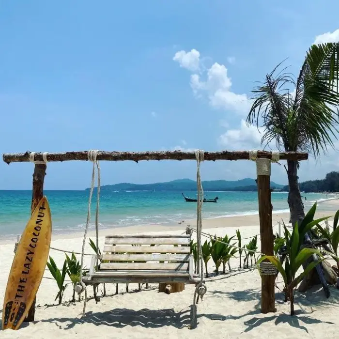 Wooden swings on the sand at a beach bar